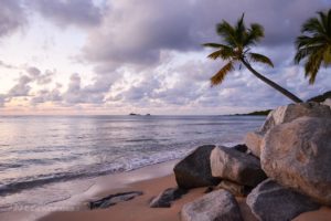 Pristine Mahoe Bay Beach with volcanic rock formations and turquoise waters near Adagio Villa in Virgin Gorda, British Virgin Islands (BVI)