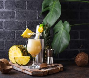 Tropical piña colada cocktail at Adagio Villa Virgin Gorda with fresh pineapple and coconut - luxury Caribbean vacation refreshment