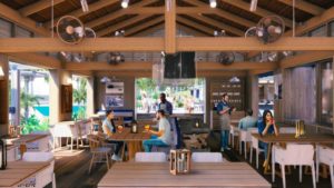 Modern indoor restaurant with wooden beams, open layout, and guests enjoying drinks at Adagio Villa Resort.